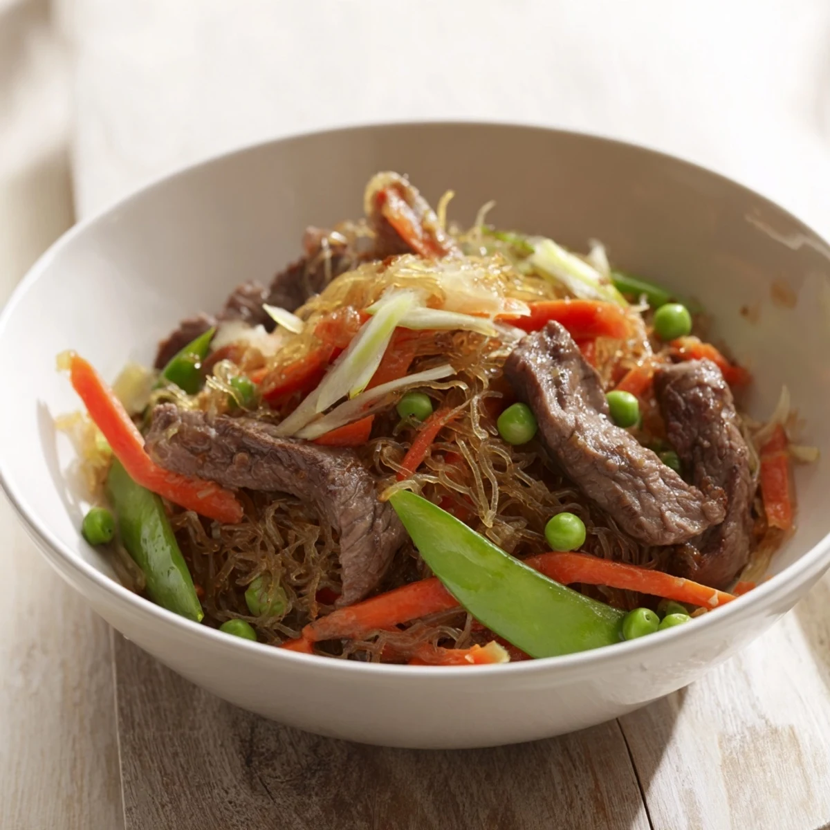 Savory, flavorful Skillet Beef Stir-Fry with tender beef strips, crisp snap peas, and carrots.