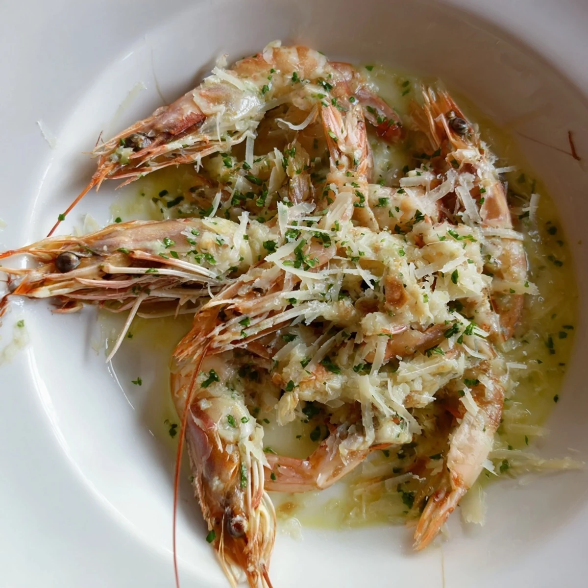 Sizzling skillet of The Ultimate 20-Minute Creamy Garlic Shrimp, garnished with fresh parsley.