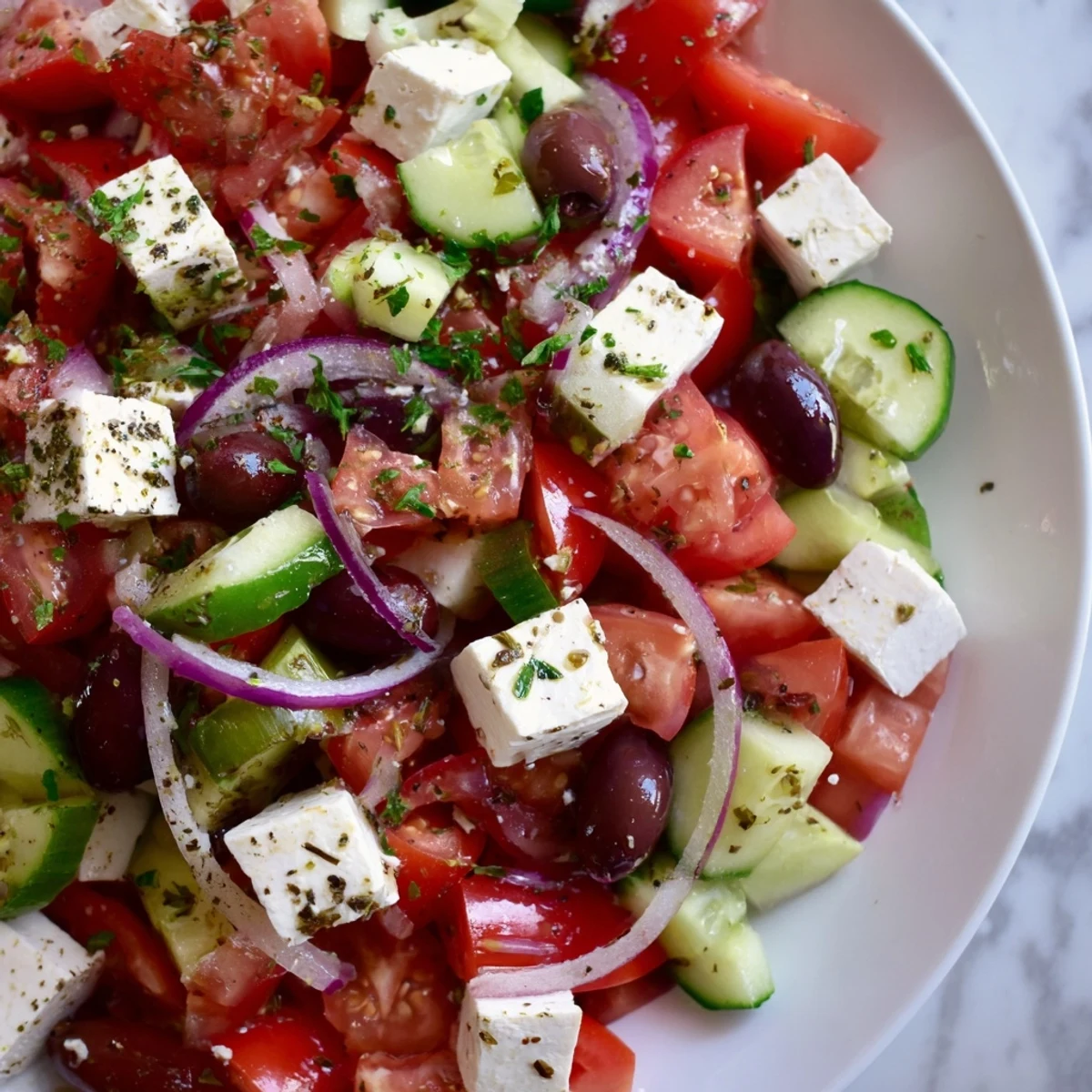 Freshly assembled Mediterranean Salad, a light and refreshing dish perfect for a summer meal.