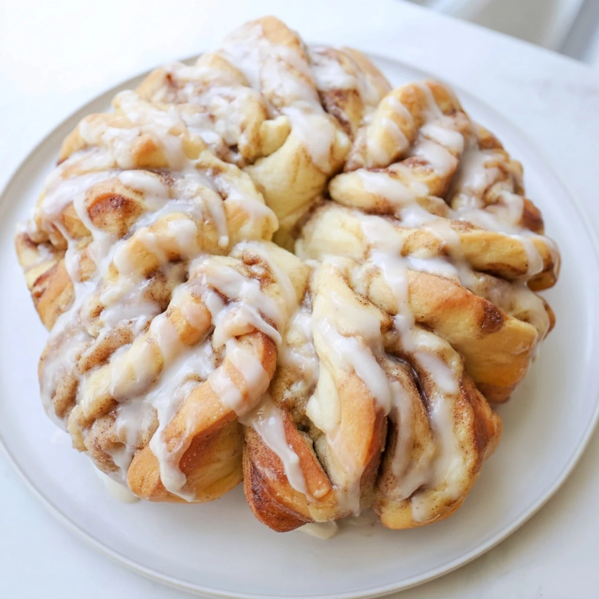 Golden-brown Cinnamon Roll Pull-Apart Snowflake with swirls of cinnamon sugar, ready to savor.