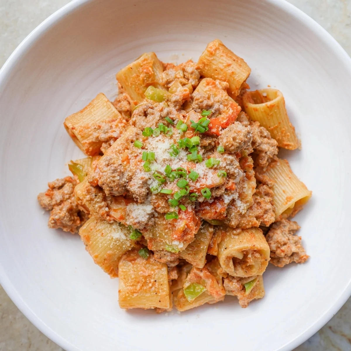 A close-up of the flavorful Chaos Cooking Kimchi Ragu Pasta, showcasing the vibrant textures in each bite.