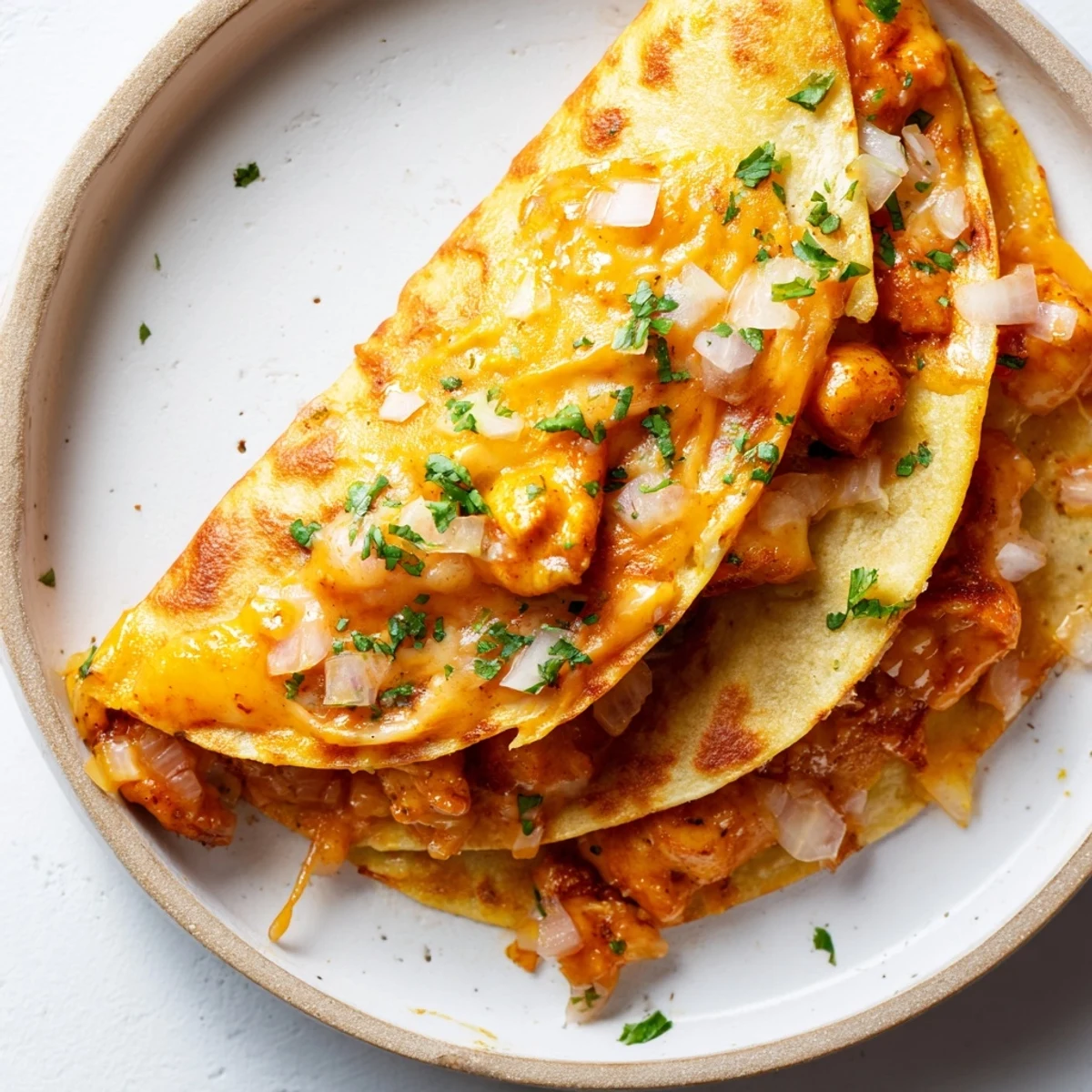 Melted cheese and rich butter chicken filling a golden, crispy Butter Chicken Quesadilla, ready to eat!