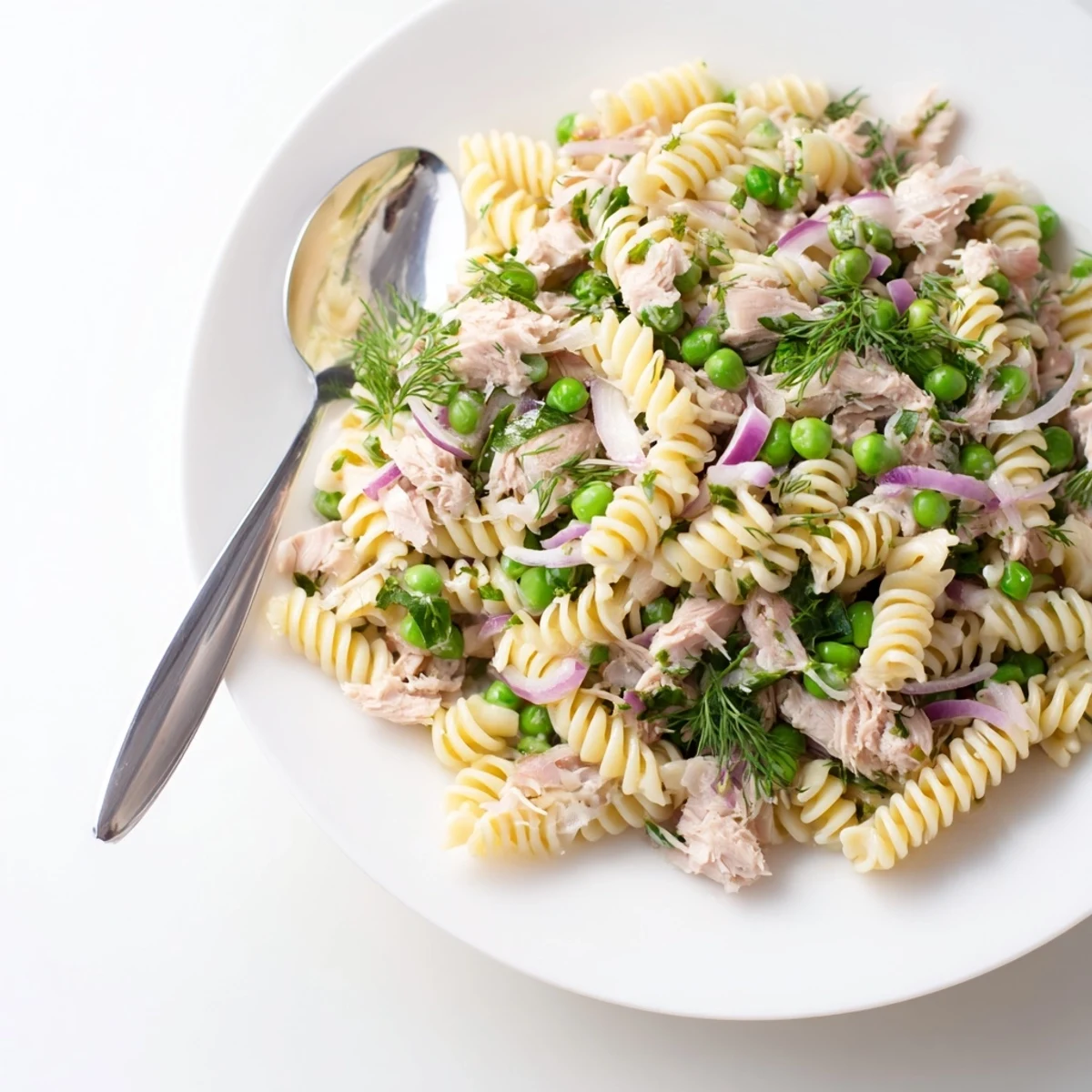 Fork-tender pasta and tender tuna flakes tossed in a zesty vinaigrette make this Lemony Tuna Pasta Salad appetizing.