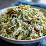 Creamy dressing clings to crisp green and red cabbage and shredded carrots in a refreshing coleslaw for summer picnics.
