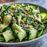 Bright lemon shaved zucchini ribbon salad with Parmesan, perfect for summer dining.