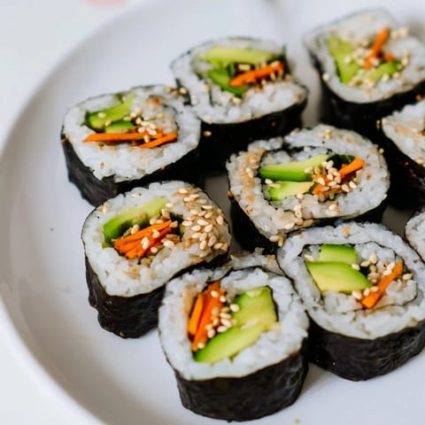 These fresh Avocado Cucumber Sushi pieces are ready to be dipped in soy sauce and enjoyed.