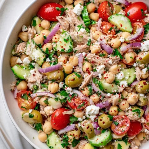 Flavorful Tuna Chickpea Salad overflowing with colorful vegetables, a quick and easy lunchtime favorite.