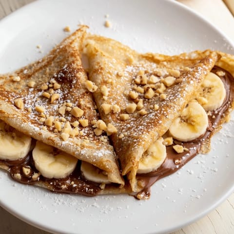 Warm folded Banana Nutella Wrap dessert, a quick and delicious sweet treat with fresh fruit.