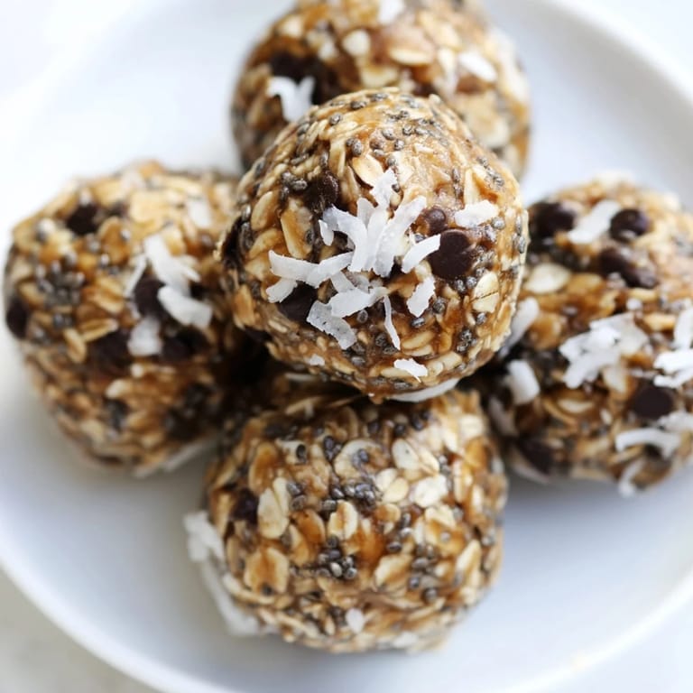 Close-up of freshly made Almond-Chia Energy Bites, showing a rich, creamy color, ideal for a sweet treat.