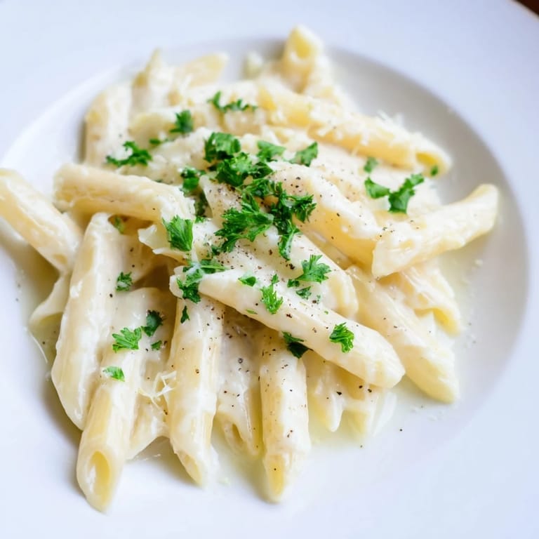 Creamy Milk Pasta One-Pot served in a bowl, showing a silky sauce clinging to penne noodles.  